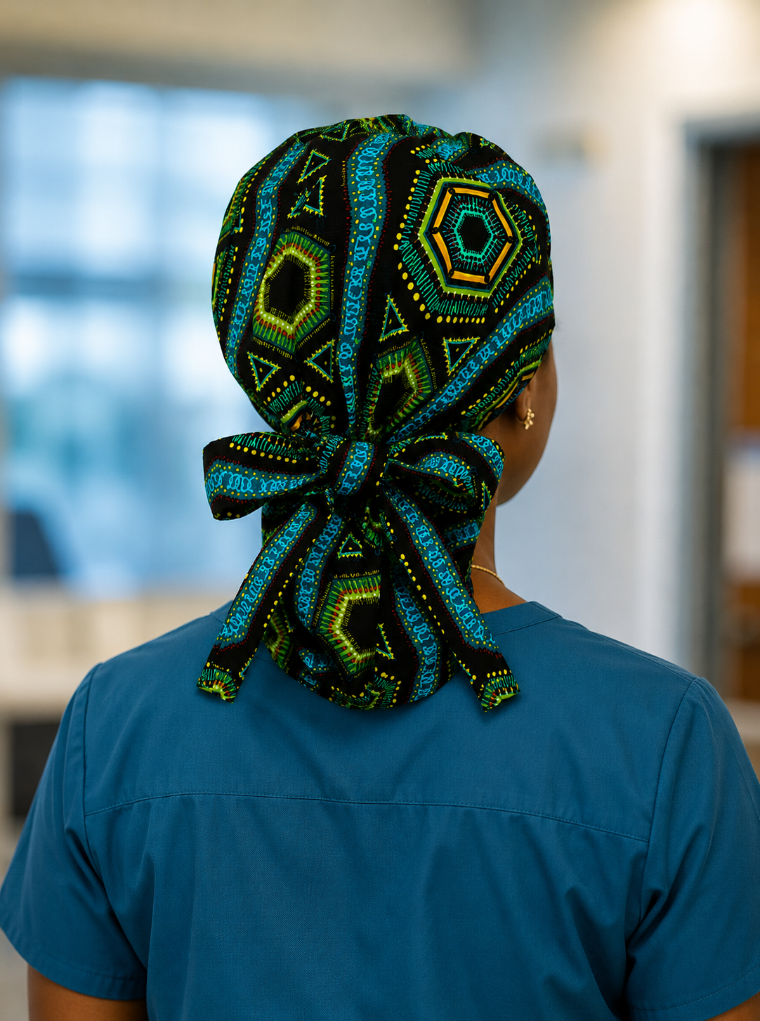 Colorful Spirit African print ponytail scrub cap back view showing full cap shape and bold geometric teal green gold pattern handmade USA