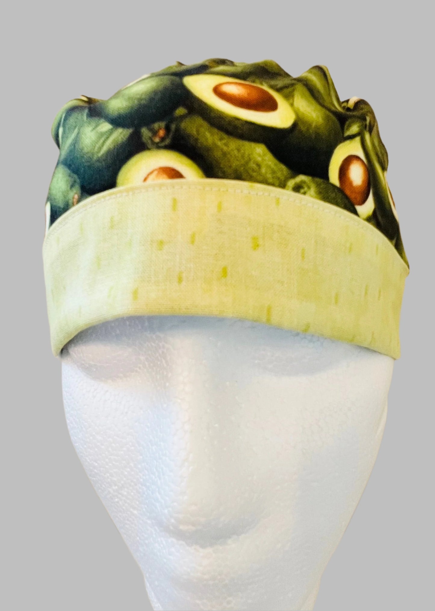 ponytail surgical scrub hat with green avocados - front