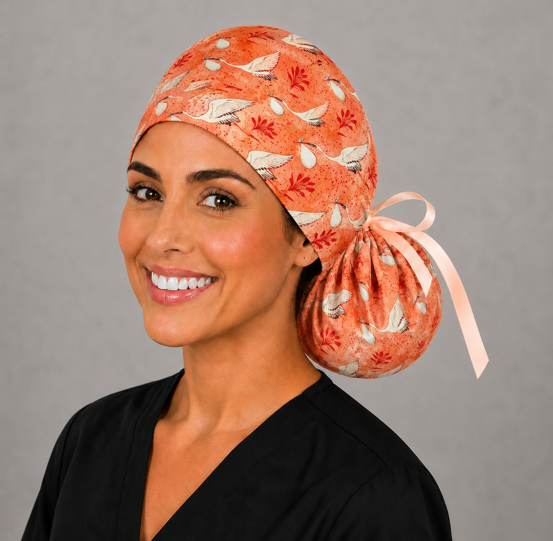 Coral stork ponytail Surgical Hat for women in labor & delivery, OB and GYN nurses. Back pouch for long hair, XL/XXL, optional satin lining. L and D Scrub Caps Handmade in the USA.