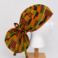 Orange green African Kente print XL ponytail scrub cap Ghana inspired surgical hat for nurses with long braids locs and natural hair handmade OR World-side view