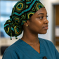 Nurse wearing Colorful Spirit African print ponytail scrub cap hospital setting bold geometric teal green gold surgical hat OR World