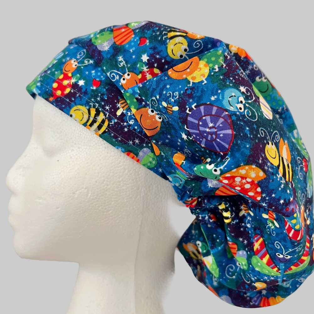 Colorful bug and butterfly Euro scrub cap handmade in the USA. Adjustable unisex cotton surgical hat and OR cap for nurses, surgeons, surgical techs, veterinarians, dentists, medical students, and healthcare professionals. Optional satin lining available.