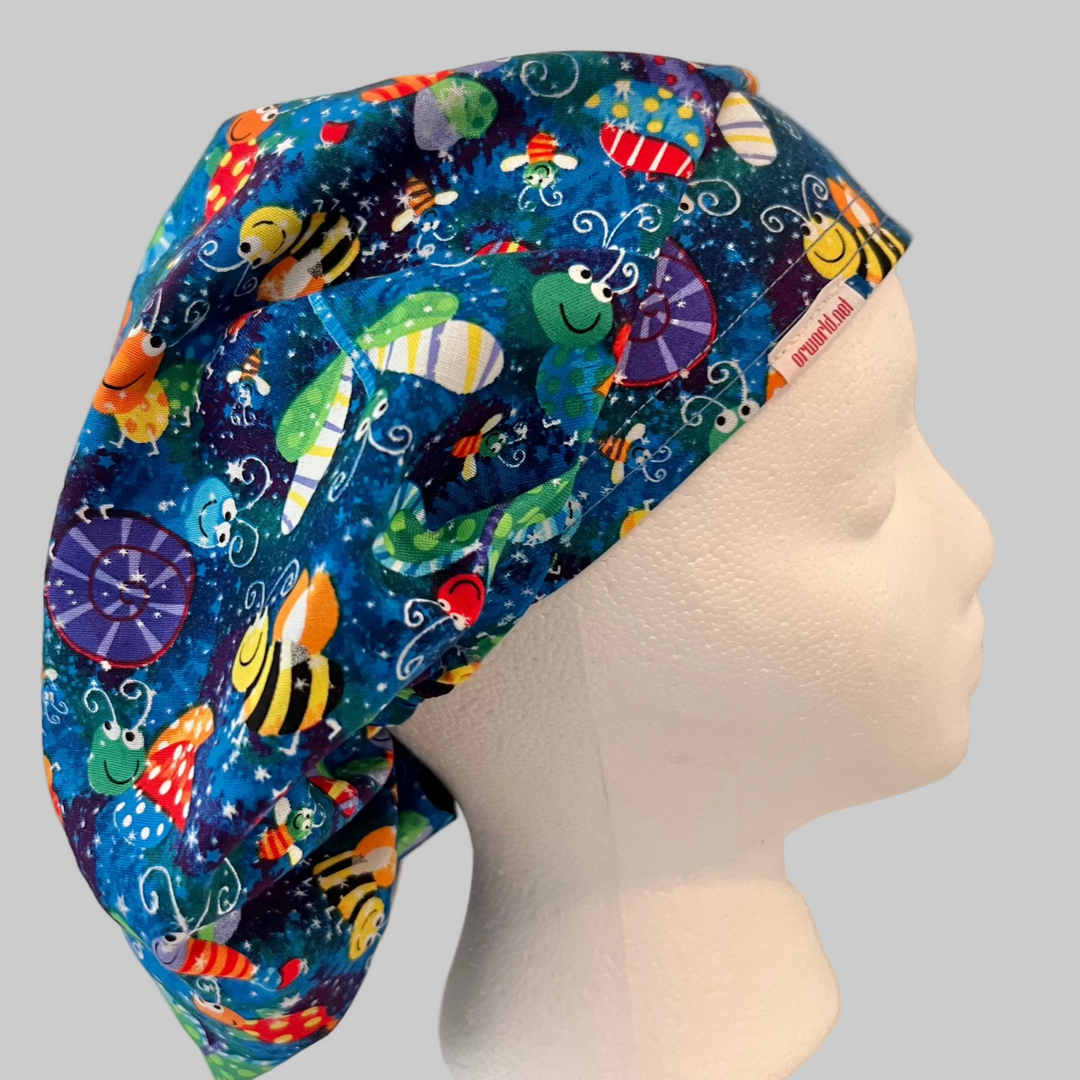 Colorful bug and butterfly Euro scrub cap handmade in the USA. Adjustable unisex cotton surgical hat and OR cap for nurses, surgeons, surgical techs, veterinarians, dentists, medical students, and healthcare professionals. Optional satin lining available.