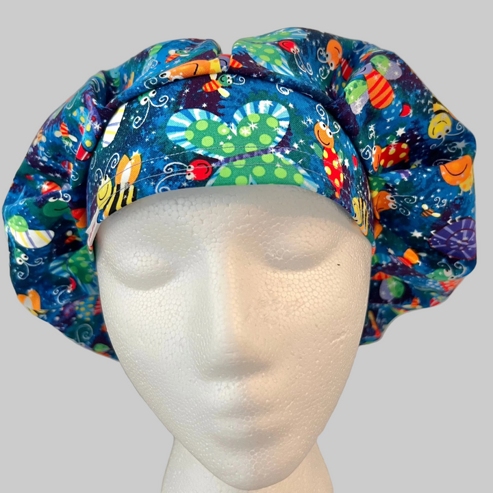 Colorful bug and butterfly Euro scrub cap handmade in the USA. Adjustable unisex cotton surgical hat and OR cap for nurses, surgeons, surgical techs, veterinarians, dentists, medical students, and healthcare professionals. Optional satin lining available.