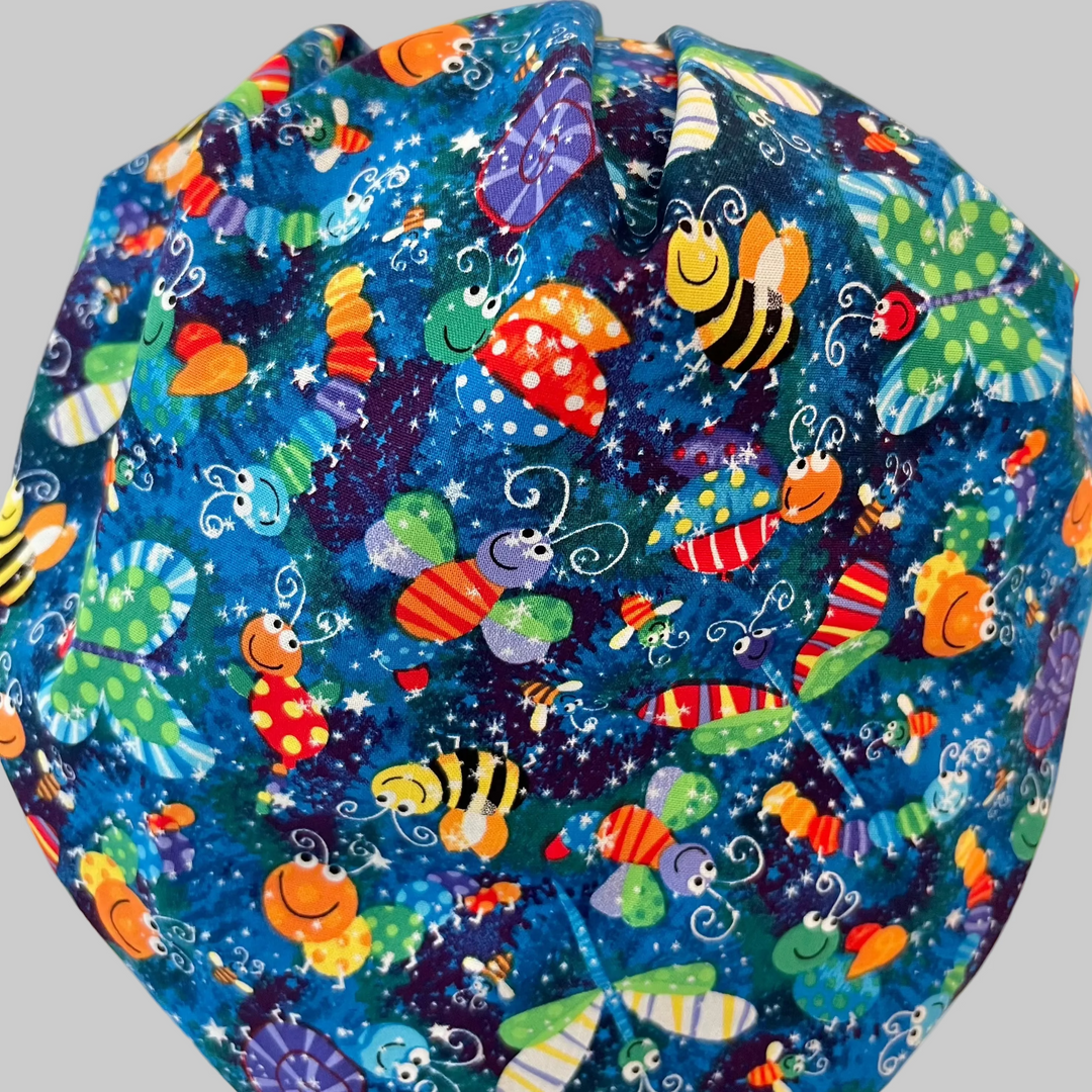 Colorful bug and butterfly Euro scrub cap handmade in the USA. Adjustable unisex cotton surgical hat and OR cap for nurses, surgeons, surgical techs, veterinarians, dentists, medical students, and healthcare professionals. Optional satin lining available.