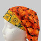 Fall pumpkin bouffant scrub cap with orange pumpkins and yellow sunflower band, side view, handmade by OR World