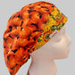 Fall pumpkin bouffant scrub cap with sunflower band, opposite side view, handmade autumn surgical hat, OR World