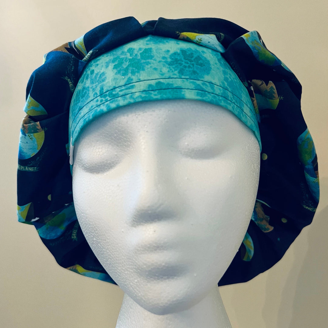 Front view of navy Save the Planet earth &amp; trees bouffant scrub cap — handmade USA unisex surgical hat for OR nurses &amp; surgeons.