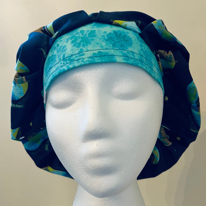 Front view of navy Save the Planet earth &amp; trees bouffant scrub cap — handmade USA unisex surgical hat for OR nurses &amp; surgeons.