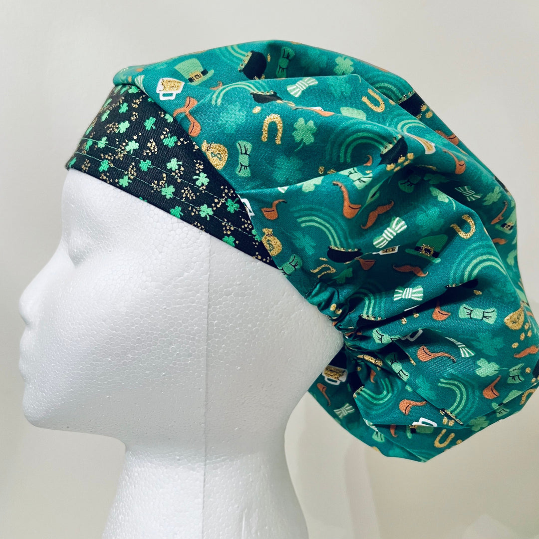 St. Patrick's Day lucky bouffant scrub cap with pots of gold, rainbows and horseshoes on teal, side view, handmade by OR World