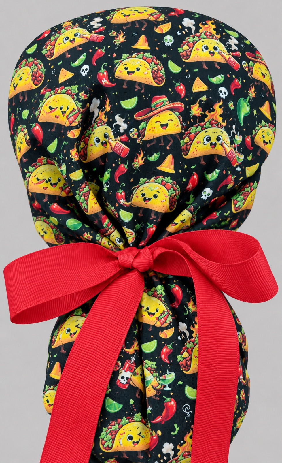 Back of the Mexican food ponytail cap showing the gathered hair pouch tied with a bright red grosgrain ribbon bow