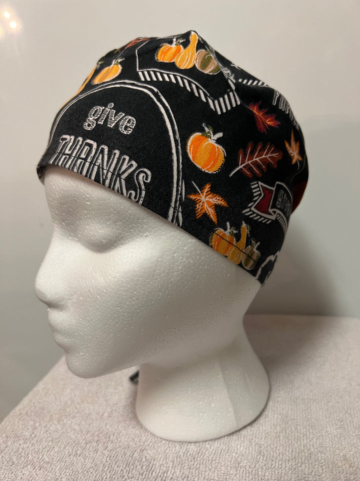 Thanksgiving "Blessed &amp; Thankful" tie-back scrub cap with fall lettering on a model — handmade-in-USA surgical hat from OR World.