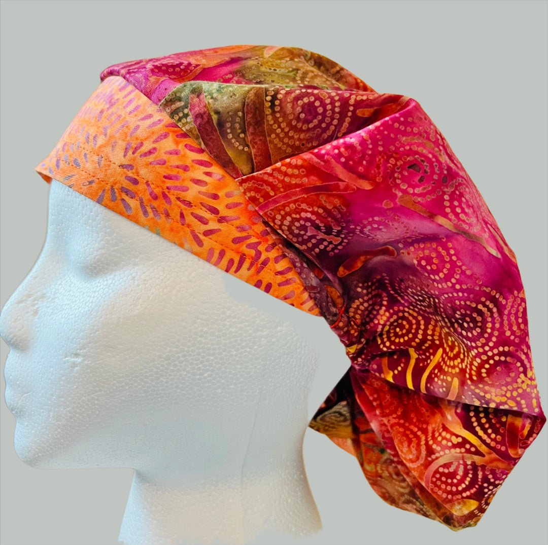 Pink &amp; orange batik bouffant scrub cap in fuchsia and citrus tones — handmade-in-USA surgical hat for women, OR nurses &amp; surgeons.