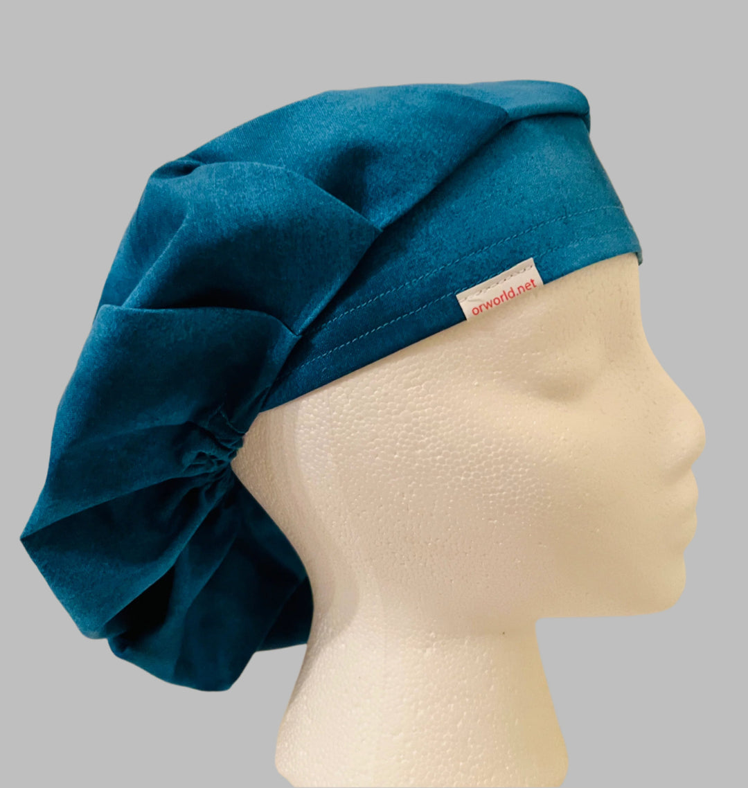Side view of solid country blue bouffant scrub cap — handmade-in-USA men&