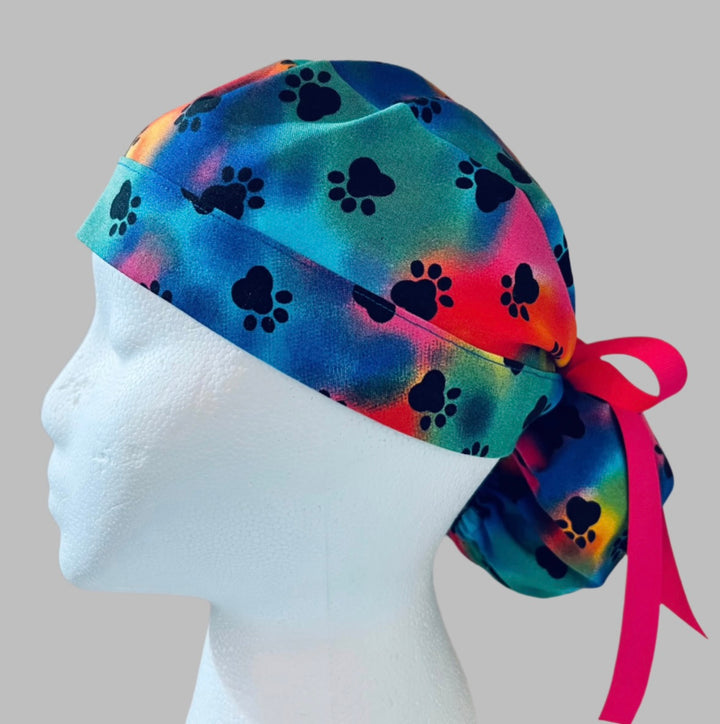 Ponytail Scrub Cap for Women | Tie Dye Puppy Paw Rainbow Surgical Hat | left side view