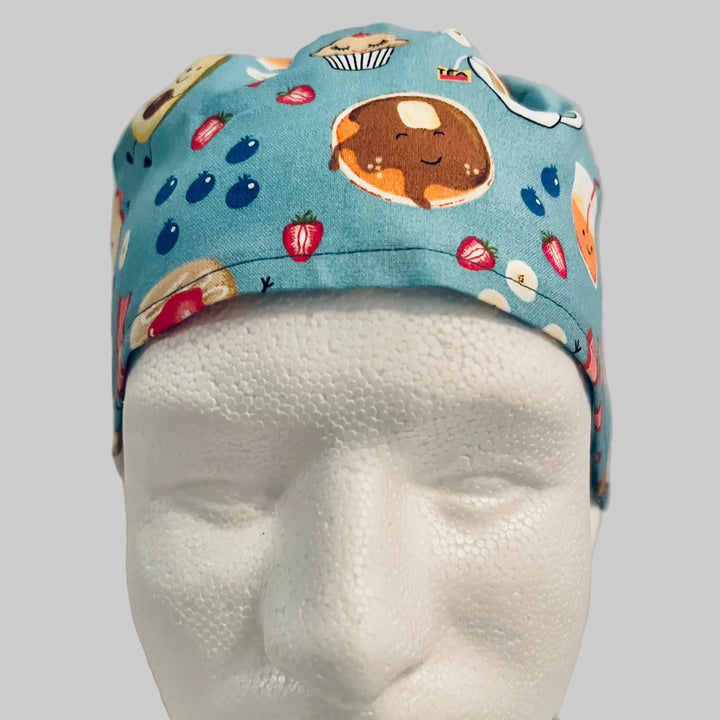 Cute breakfast food traditional tie-back scrub cap with bacon, waffles, eggs and coffee, side view, handmade by OR World