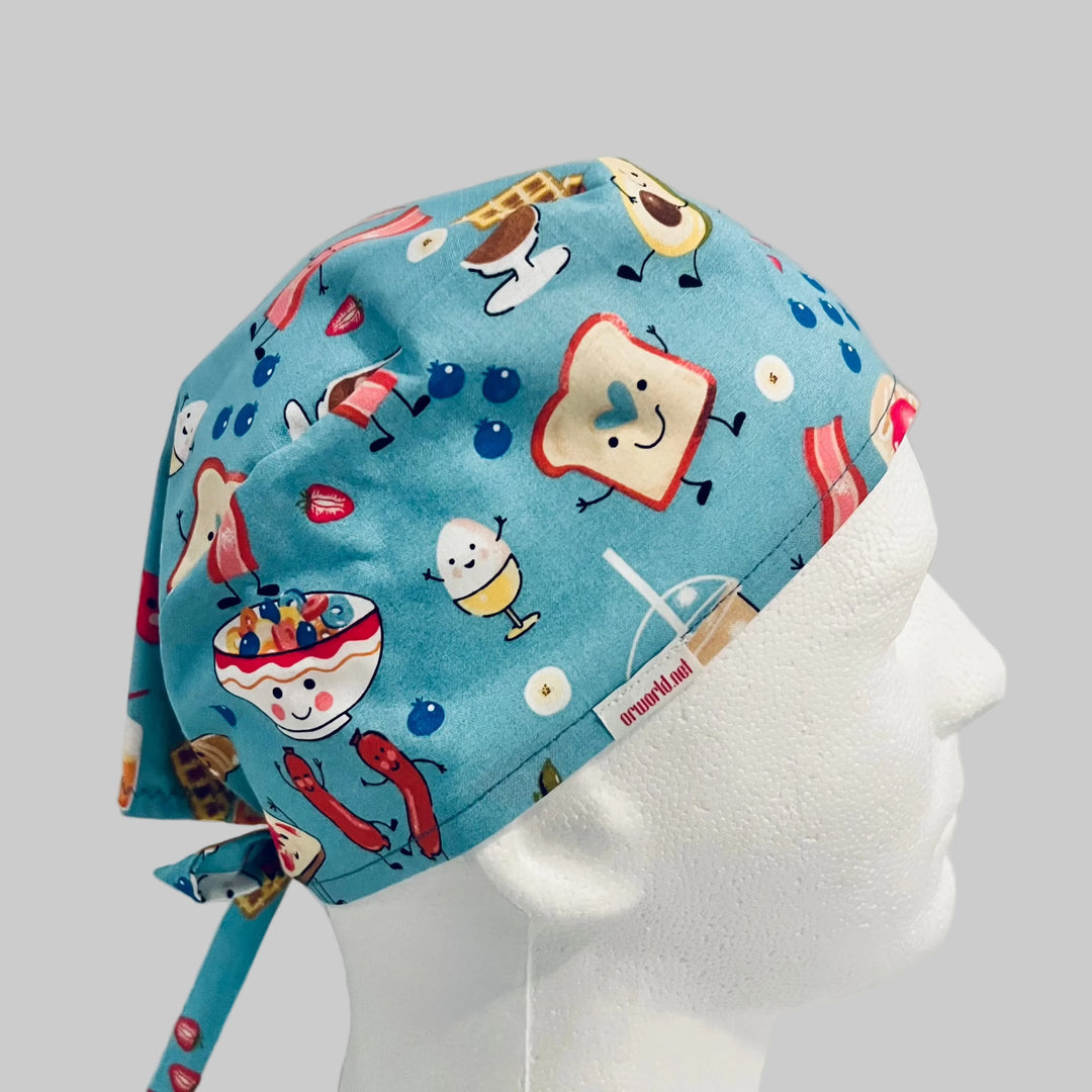 Breakfast food scrub cap for men and women, front view, pancakes bacon eggs print, OR World