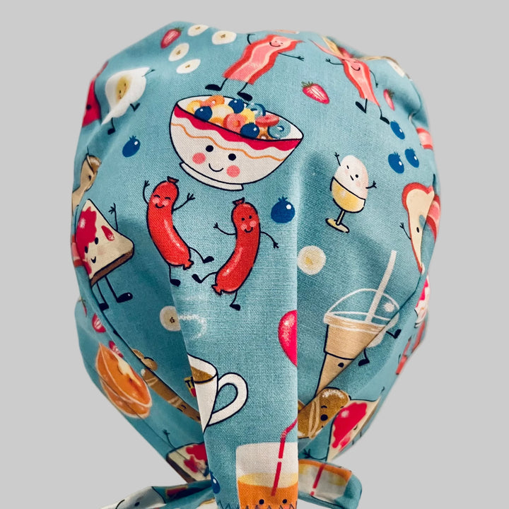Breakfast food traditional scrub cap, top and back view, cereal sausage and toast print, OR World