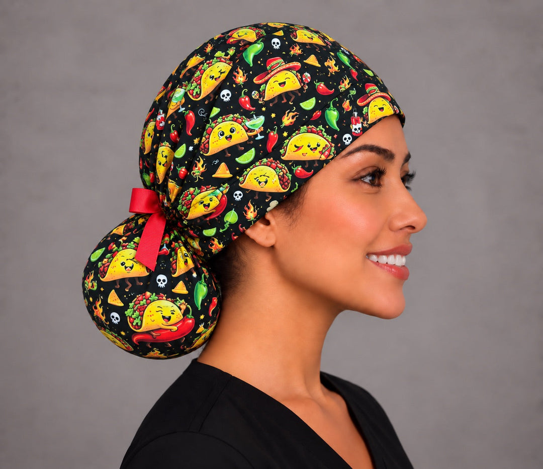 Side profile of the taco nurse hat showing the deep pouch that holds long or thick hair and the large-scale chili and taco print