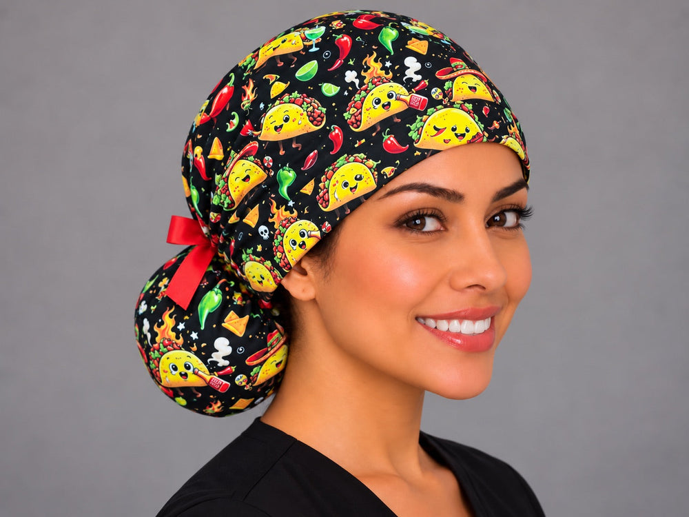 Smiling nurse facing forward in a black taco print ponytail surgical cap with a sombrero taco centered on the front band