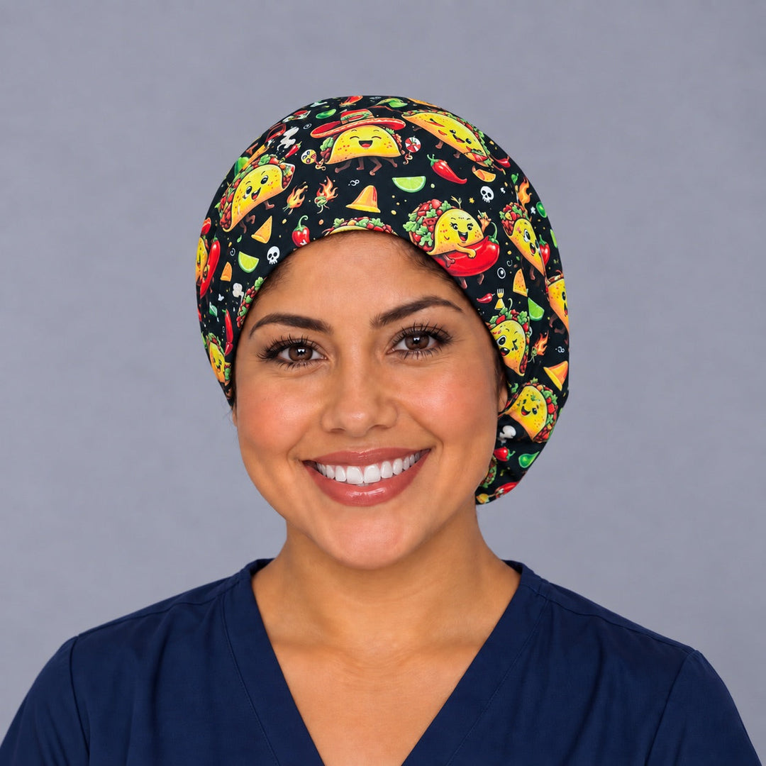 Smiling nurse facing forward in a black taco print euro scrub cap with a sombrero taco centered on the front band above her brow