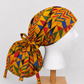African Kente print XL ponytail scrub cap side view showing extra large hair pouch for braids locs and natural hair