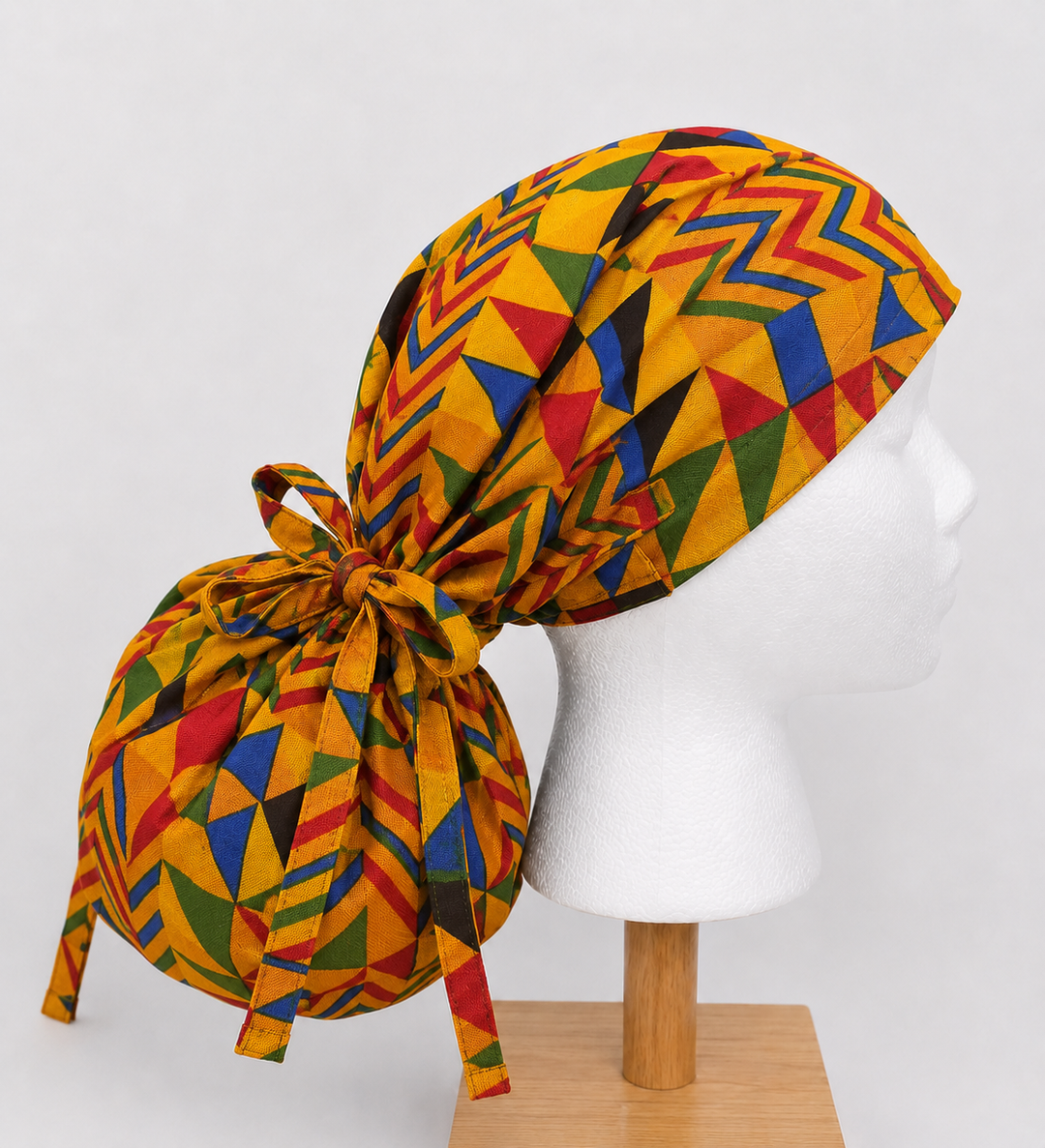 African Kente print XL ponytail scrub cap side view showing extra large hair pouch for braids locs and natural hair