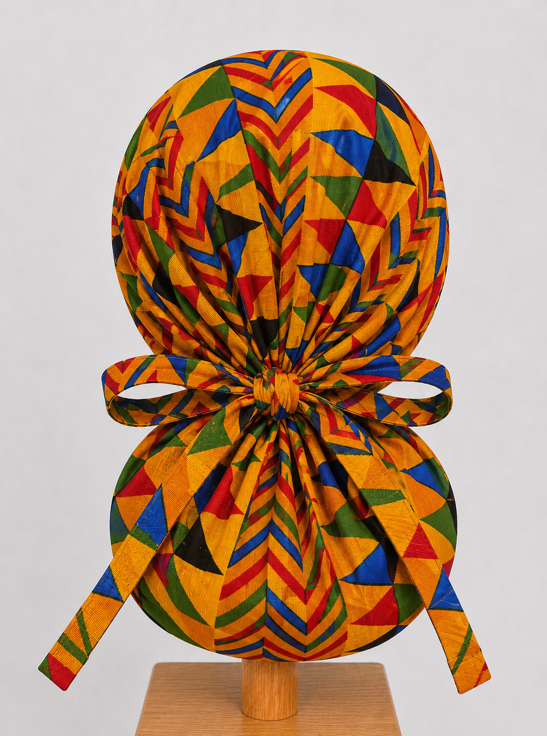 African Kente print XL ponytail scrub cap back view showing extra large hair pouch for braids locs and natural hair