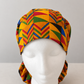 African Kente print XL ponytail scrub cap front view gold red green geometric pattern handmade surgical hat for nurses