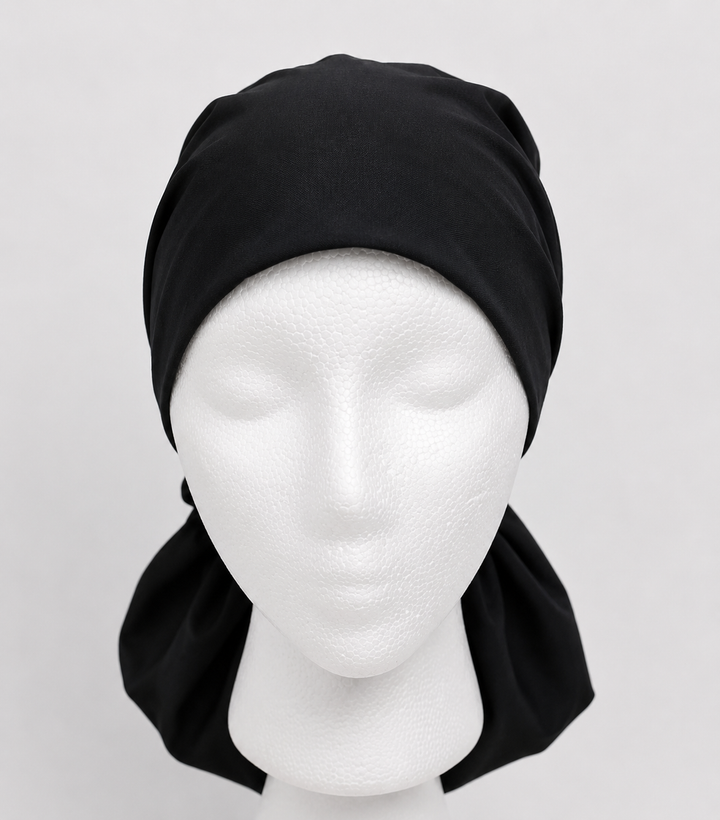Black XL ponytail scrub cap with satin lining front view on mannequin for nurses with natural hair
