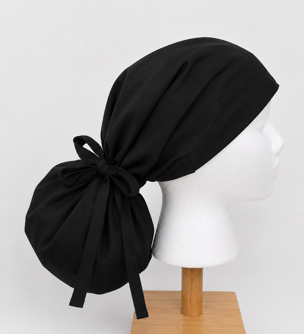 Black XL ponytail scrub cap side view showing extra large pouch for thick and long hair