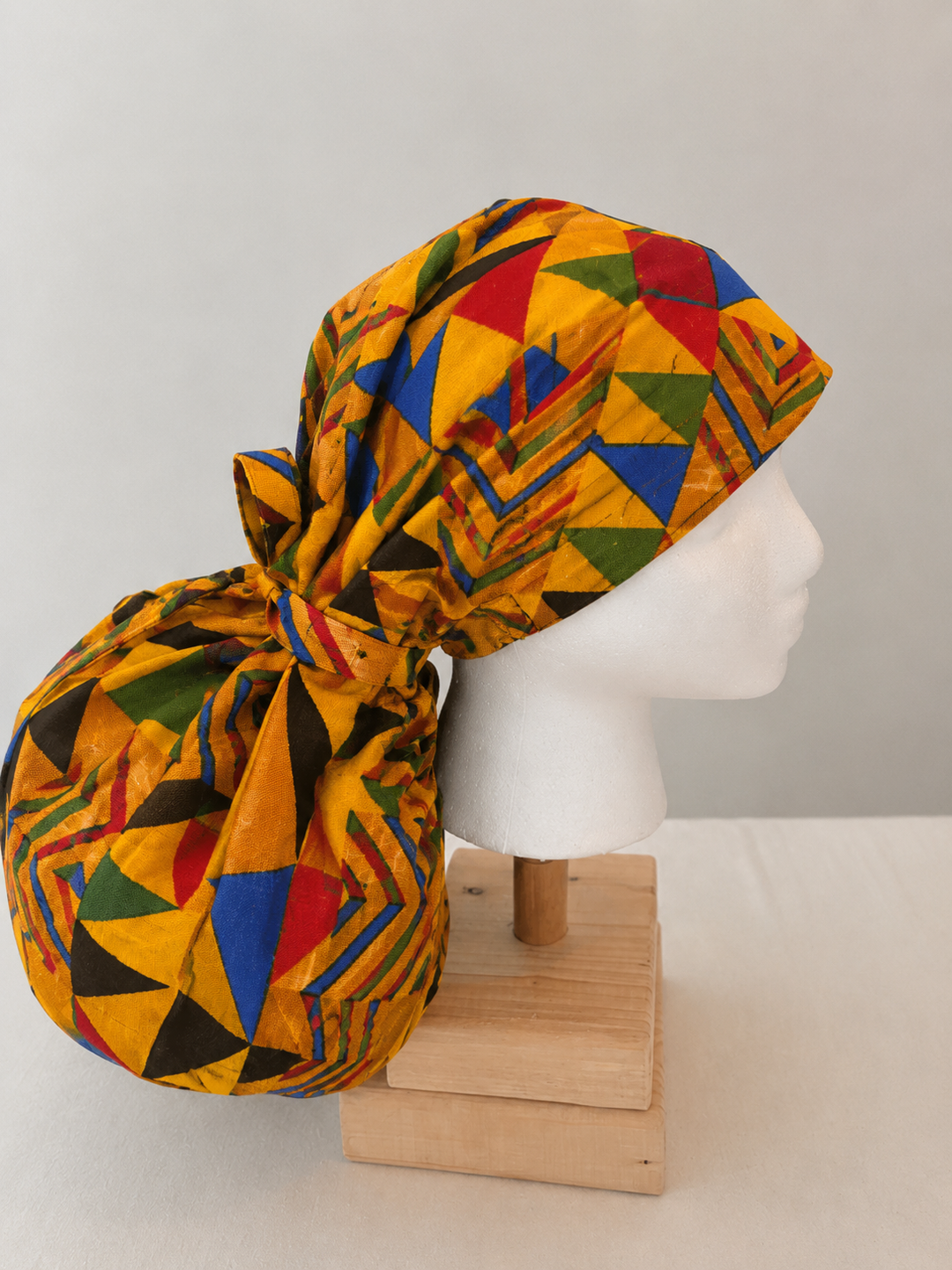 African Kente XXL ponytail scrub cap side view showing extra extra large hair pouch for jumbo locs long braids and thick natural hair