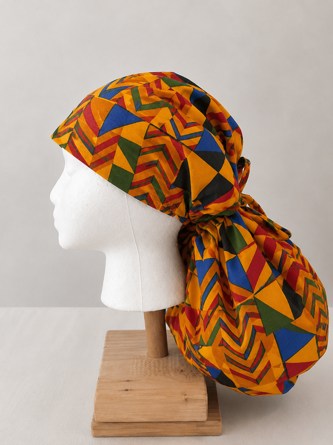 African Kente XXL ponytail scrub cap side view showing extra extra large hair pouch for jumbo locs long braids and thick natural hair