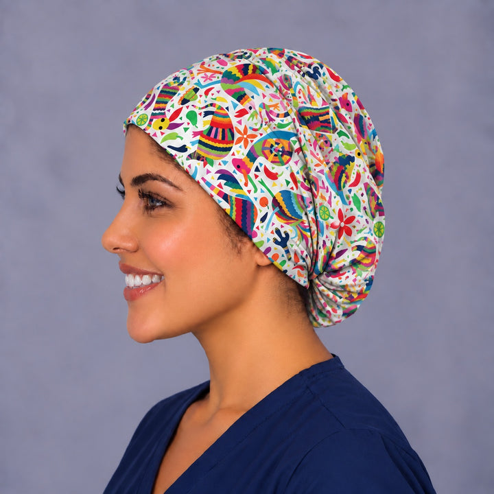Left profile of an adjustable euro scrub cap for short and long hair in 100% cotton, showing full coverage to the nape and tiny cactus and lime slice details