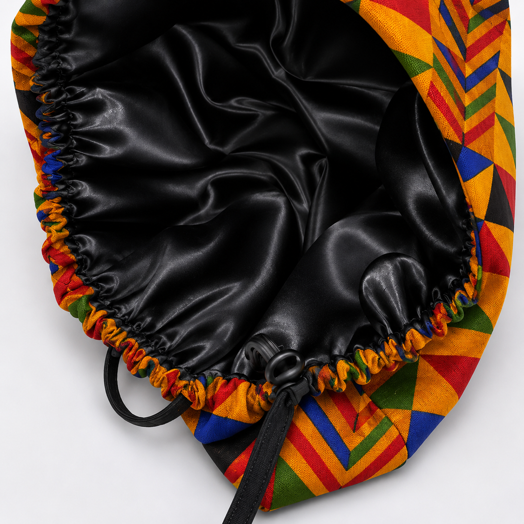 Colorful Geometric African Kente bouffant scrub cap flat lay showing black satin lining interior bold Ghana triangle pattern surgical hat handmade USA