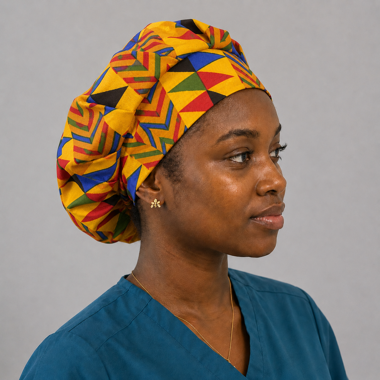 Colorful Geometric African Kente bouffant scrub cap left side view bold gold blue red green black triangle Ghana pattern surgical hat nurses healthcare professionals