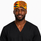 Male healthcare professional wearing Colorful Geometric African Kente mens tieback scrub cap bold gold blue red green triangle pattern Ghana surgical hat black scrubs OR World