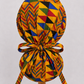 Colorful Geometric African Kente ponytail scrub cap back view showing tie closure bold gold blue red green Ghana Kente triangle print surgical hat handmade USA