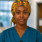 Nurse wearing Colorful Geometric African Kente ponytail scrub cap bold gold blue red green triangle pattern Ghana surgical hat hospital setting teal scrubs OR World