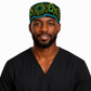 Male healthcare professional wearing Colorful Spirit African Kente mens tieback scrub cap bold black background teal green gold geometric pattern surgical hat black scrubs OR World