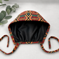 Empowered Energy African Kente mens tieback scrub cap flat lay showing black satin lining interior traditional Ghana diamond pattern surgical hat handmade USA