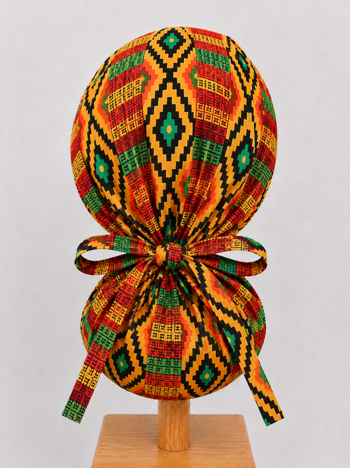 Empowered Energy African Kente ponytail scrub cap back view showing tie closure traditional Ghana diamond Kente print orange green teal surgical hat handmade USA