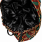 Empowered Energy African Kente ponytail scrub cap flat lay showing black satin lining interior traditional Ghana diamond pattern orange green teal surgical hat handmade USA