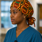 Empowered Energy African Kente ponytail scrub cap left side view traditional Ghana diamond pattern orange green teal black surgical hat nurses healthcare professionals
