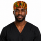 Male healthcare professional wearing African Kente Ghana men's tieback scrub cap traditional orange green geometric pattern surgical hat black scrubs OR World