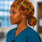 African Kente Ghana original ponytail scrub cap left side view traditional orange green brown black geometric pattern surgical hat nurses healthcare professionals