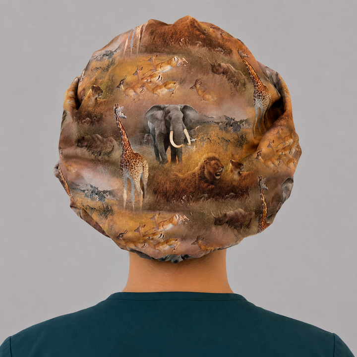 African safari wildlife bouffant scrub cap for women, back view, elephant lion giraffe zebra print, OR World