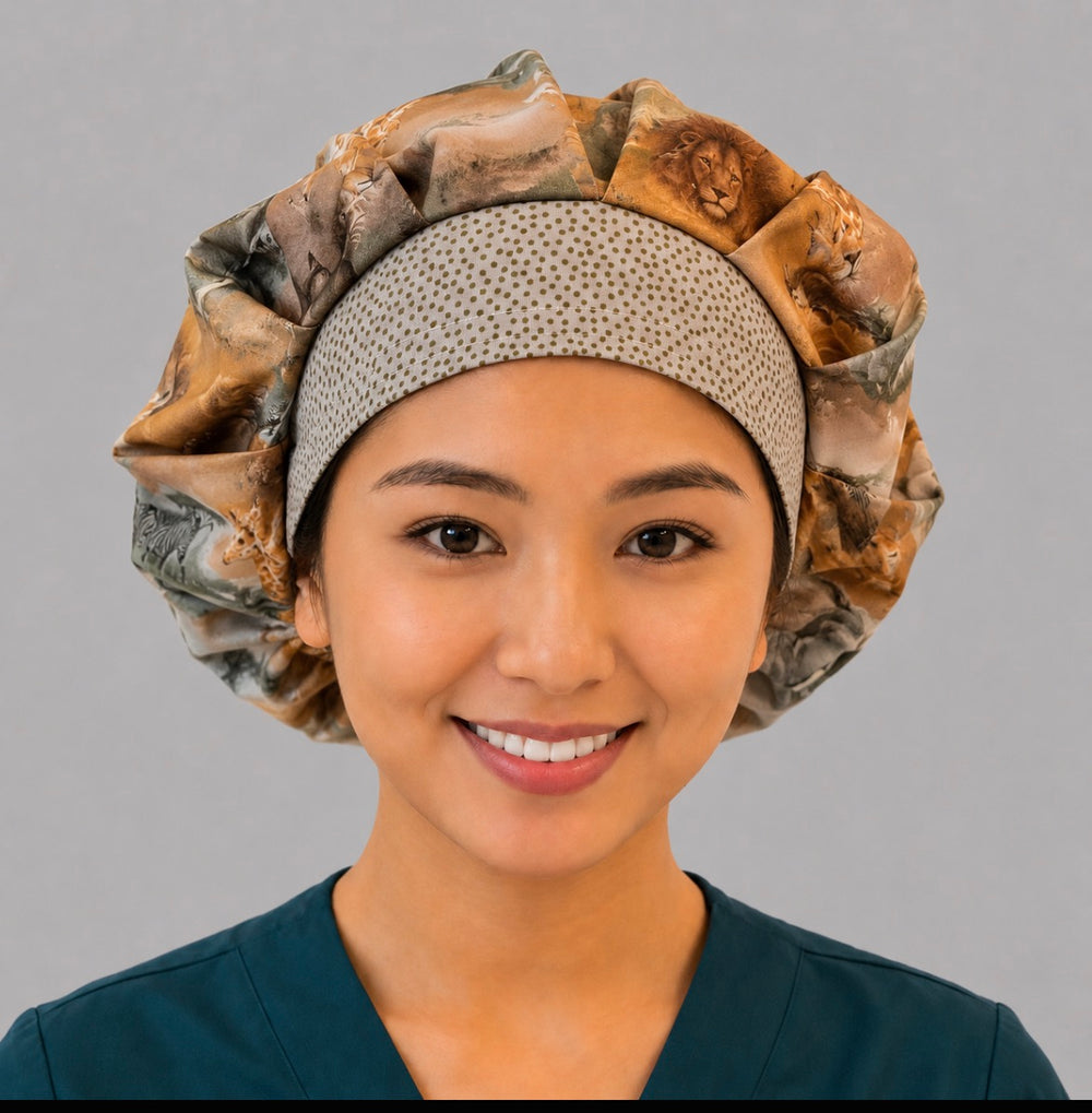 African safari wildlife bouffant scrub cap for women, front view, elephants lions giraffes and zebras savanna print with gold dot band, handmade by OR World