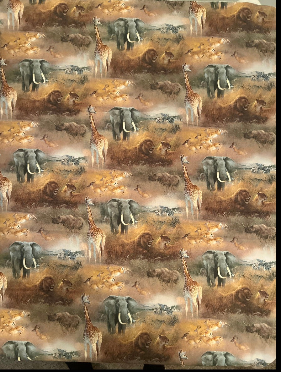 African safari animal print scrub cap fabric close-up with elephant, lion, giraffe, zebra and rhino savanna scene, OR World