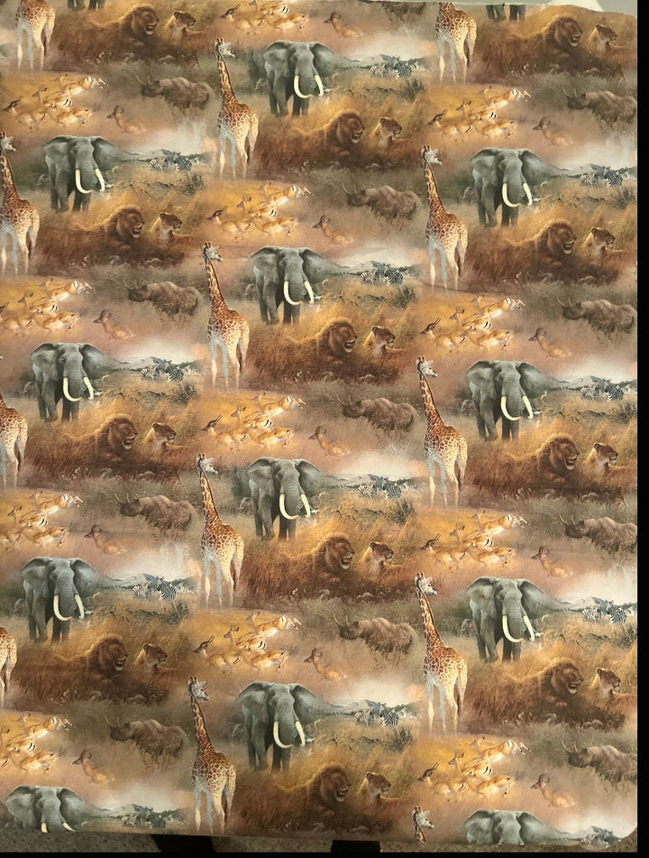 African safari animal print scrub cap fabric close-up with elephant, lion, giraffe, zebra and rhino savanna scene, OR World